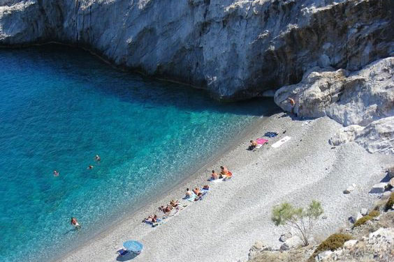 Katergo Beach with dramatic cliffs and crystal-clear waters